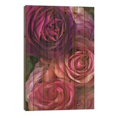 an abstract painting of pink roses on wooden planks