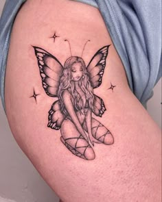 a woman's thigh with a fairy tattoo on it