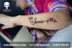 a woman with a tattoo on her arm that reads sona - ha and has a crown