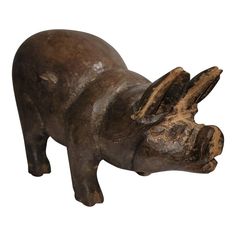 a wooden sculpture of a hippocer on a white background