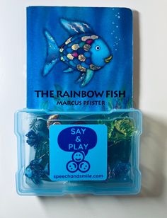 the rainbow fish match is in its plastic case and it's blue with gold accents