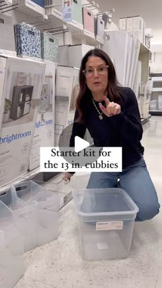 a woman kneeling on the floor in front of some boxes and bins with text reading starter kit for the 13m cubicles