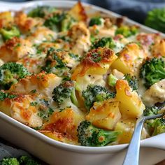 a casserole dish with broccoli, chicken and cheese in it is ready to be eaten