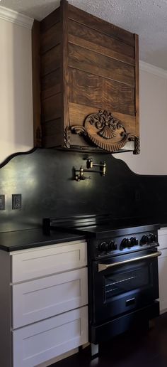 an old fashioned stove and oven in a kitchen