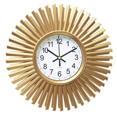 a gold clock with white face and numbers in the middle is on a white background