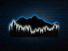 a night scene with mountains, trees and blue lights on a brick wall in the dark