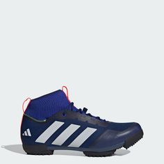 the adidas shoes are blue and white with red detailing on the upper part of the shoe