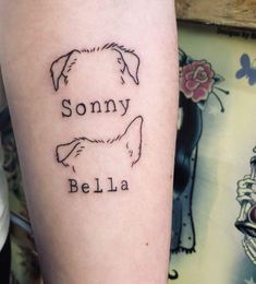 a tattoo on the arm of a person with a dog's face and name