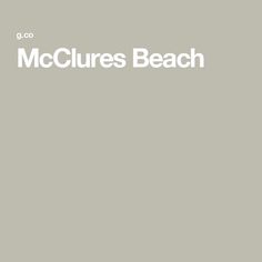 the words mccures beach on a gray background