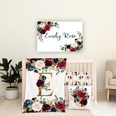 a baby crib bedding set with flowers and the name's on it