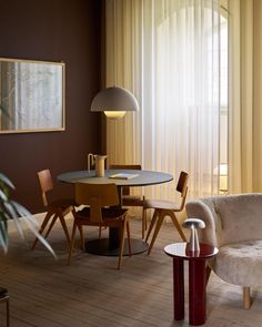 a living room filled with furniture next to a window