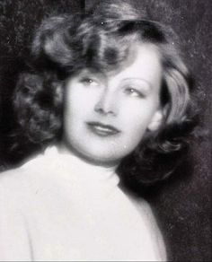 an old black and white photo of a woman