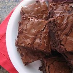 some brownies are on a white plate