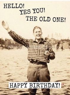 a man standing on top of a boat in the water with his arms raised up