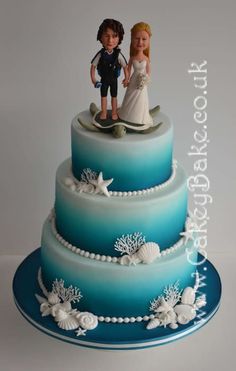 there is a wedding cake with two people on top