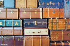 many old suitcases stacked on top of each other royalty photo