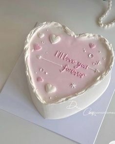 a heart shaped cake with the words i love you forever on it