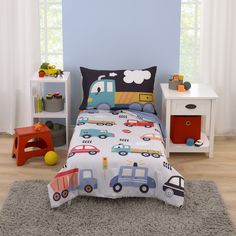 a child's bed with cars and trucks on it