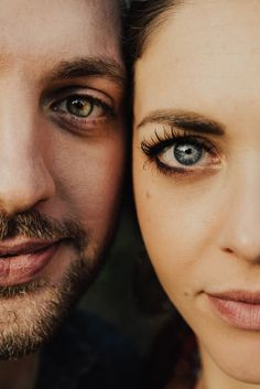 a man and woman with blue eyes posing for the camera