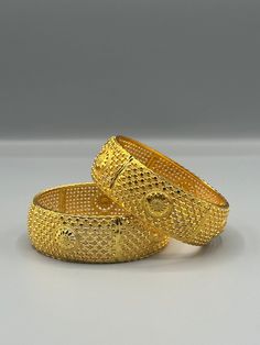 Our 24k Polished Bangles are more than just accessories; they are symbols of grace and beauty, inspired by the rich heritage of Indian, Pakistani, and Nepali jewelry. These stunning bangles showcase the timeless elegance of traditional craftsmanship, perfectly complementing your attire for weddings, festivals, or any special occasion Our company offers expedited Next-Day Delivery Services within the United Kingdom, ensuring prompt and efficient transportation of goods.  Additionally, we strive to extend our shipping capabilities to cater to customers worldwide, aiming to provide the fastest possible shipping methods to international destinations. To ensure the highest standards of hygiene, we kindly request your understanding that all sales are final, and we are unable to accept returns or Traditional Yellow Gold Bangle With Intricate Design, Gold Classic Ceremonial Jewelry, Classic Gold Jewelry For Ceremonial Occasion, Classic Gold Ceremonial Jewelry, Classic 22k Gold Ceremonial Jewelry, Ceremonial Gold Plated Elegant Bangle, Elegant Gold Plated Bangle For Ceremonial Occasions, Elegant Ceremonial Gold-plated Bangle, 22k Gold Bangle For Formal Occasions