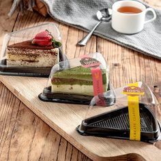 three different desserts on serving trays next to a cup of tea