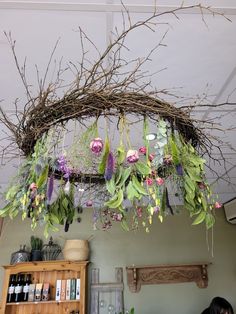 flowers hanging from the ceiling in a room