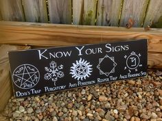 a sign that says know your signs on it in front of some rocks and gravel