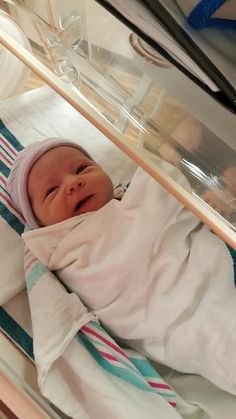 a baby is laying down in a crib