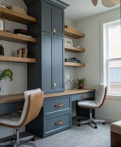 a home office with built - in shelving, desk and chair by the window