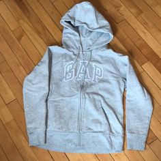 Nwot Gap Logo Hoodie In Excellent Unworn Condition, Size Medium, Heather Gray. Gap Hooded Sweatshirt With Double-lined Hood, Gap Hoodie With Letter Print For Fall, Gap Fleece Sweatshirt For Fall, Gap Hooded Hoodie For Fall, Gap Cotton Sweatshirt For Winter, Gap Sweatshirt With Adjustable Hood For Fall, Gap Hooded Tops With Ribbed Cuffs, Winter Cotton Sweatshirt By Gap, Gap Hooded Tops For Fall