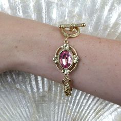 Breathtakingly feminine! Our bracelet features an oval vintage-inspired floral pendant embellished with an oval genuine Swarovski Crystal Element. With shimmering gold tones this dazzling toggle bracelet is ideal for a special occasion and whenever you simply need to feel glamorous. This vintage style bracelet is a thoughtful, generous yet affordable gift for her! Available in Light Rose Pink & Crystal Clear Measurements: 8"L x 1.13"W Made In USA 1928 JEWELRY COLLECTION From the vaults of rich E Channel Jewelry, Pretty Accessories, 1928 Jewelry, Pink Swarovski, Vintage Inspired Jewelry, Light Rose, Floral Pendant, Toggle Bracelet, Affordable Gifts