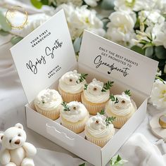 cupcakes with white frosting in a box and teddy bear figurines