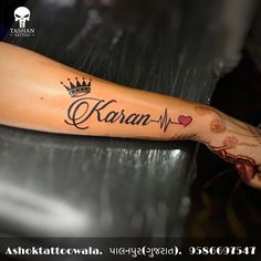 a woman's arm with a crown and name tattoo on it, which reads koran - m