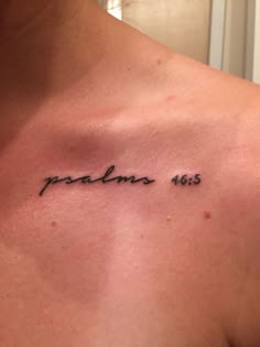 the back of a man's chest has a tattoo that reads, problems 465