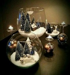 christmas decorations in glass bowls on a table