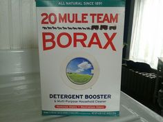 a box of borax sitting on top of a washing machine