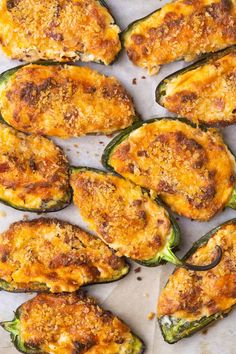 baked stuffed peppers with cheese and seasoning on top are ready to be served in the oven