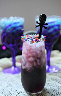 the drink is decorated with sprinkles and a black skeleton