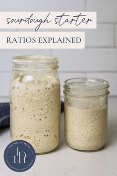 two jars filled with food sitting on top of a white counter next to each other