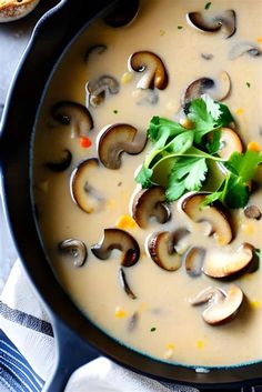 a pan filled with mushroom soup and garnished with parsley