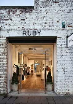 the entrance to ruby clothing store in an old brick building