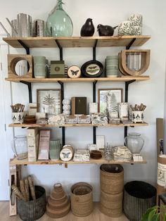 the shelves are filled with decorative items and baskets