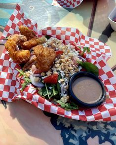 a basket filled with food sitting on top of a table