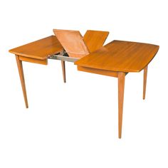 a wooden table with an open laptop on it's top and two legs that are connected to each other