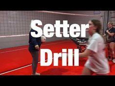 some people are playing volleyball on a red court with the words setter drill in front of them