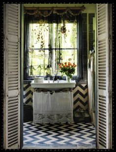 the bathroom is decorated in black and white checkered flooring, with an old fashioned tub