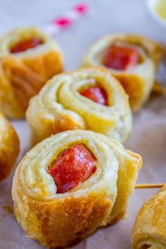 several small pastries with strawberries on them