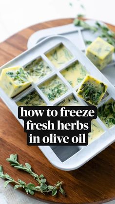 how to freeze fresh herbs in olive oil on a cutting board with text overlay that reads, how to freeze fresh herbs in olive oil