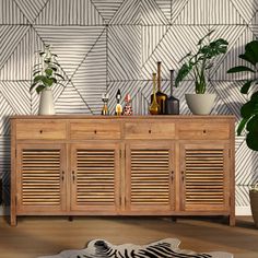 a wooden cabinet sitting next to a plant and potted plants on top of it