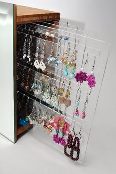 a display case holds many pairs of earrings